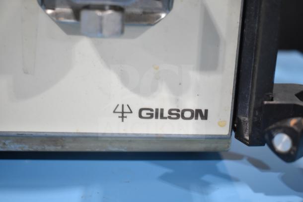 Gilson HPLC System with UV/Vis Detector, showing Gilson logo on a white panel, slight wear visible.