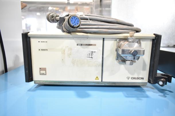 Gilson HPLC System with UV/Vis Detector, Model 306. Features control panel, attached tubes. Used condition with visible wear.