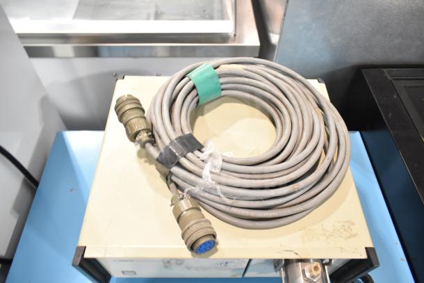 Gilson HPLC System with UV/Vis Detector; beige casing, visible cable, used condition; ideal for lab analysis.