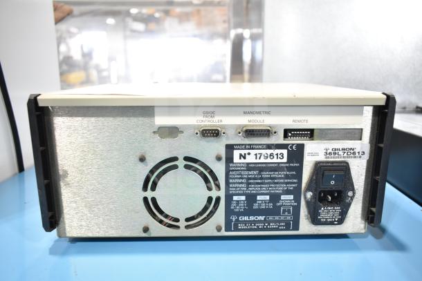 Gilson HPLC System rear view showing ports and serial number 179613. Features include GIL 369L7D613 model marking.
