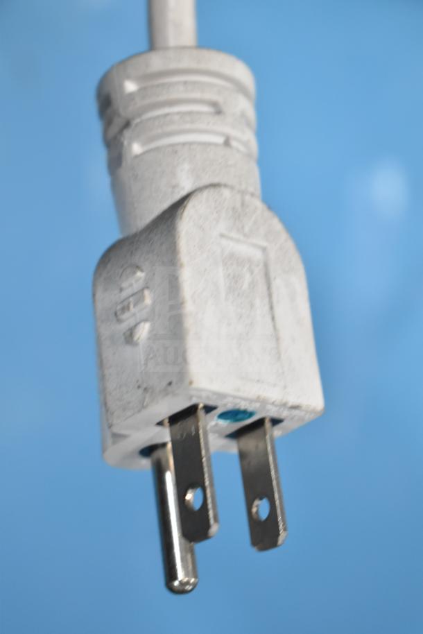 Close-up of a white electrical plug for an Accucold ARG6PV Mini Cooler Merchandiser, 110 Volts, 1 Phase.