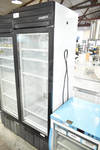 2019 Habco SE18 Commercial Single Door Reach In Cooler. Black and white exterior, glass door, shelves intact, 110V, 1 Phase.