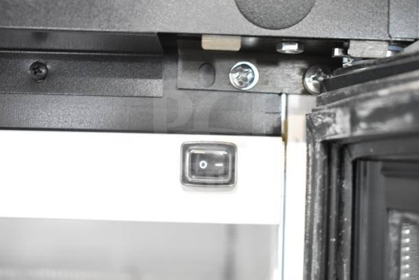 2019 Habco SE18HC cooler close-up of door hinge and power switch, showing commercial-grade quality and detail.