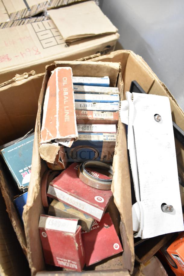 Lot of various automotive items including Fram PH4967 Extra Guard, Mopar seals, and Napa thermostat in boxes, pre-owned.