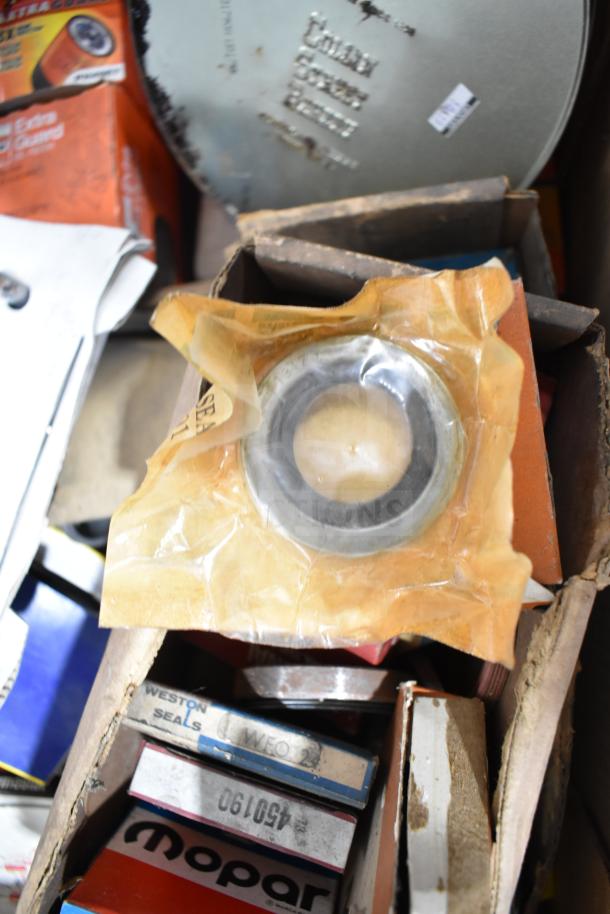 Lot of automotive items: Fram PH4967 Extra Guard, Napa thermostat, Weston seals, Mopar parts in original packaging.