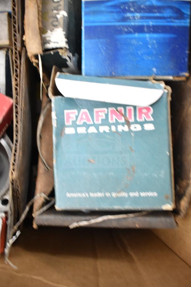 Lot of automotive items including Fafnir Bearings box, partially visible. Worn condition with signs of age and wear.