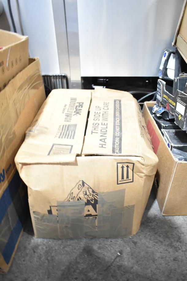 Lot of 4 mixed cardboard boxes, including one labeled "Peak." Boxes show wear; includes unspecified red items.