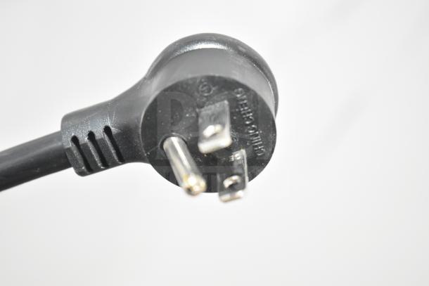 Close-up of a black electrical plug for the 2021 True TSCI-600R-G-PH cooler, showing three prongs and manufacturer markings.