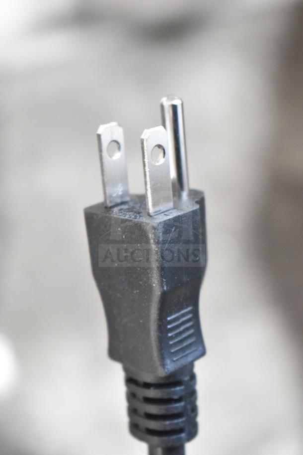 Close-up of a black power plug associated with Galaxy 17GSM2 slushy machine, 120 Volts, 1 Phase.