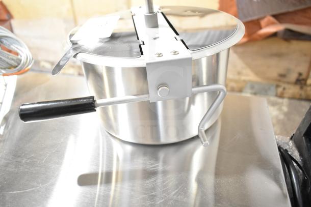 Brand new replacement kettle for popcorn popper, stainless steel, scratch and dent condition, with stirring handle.