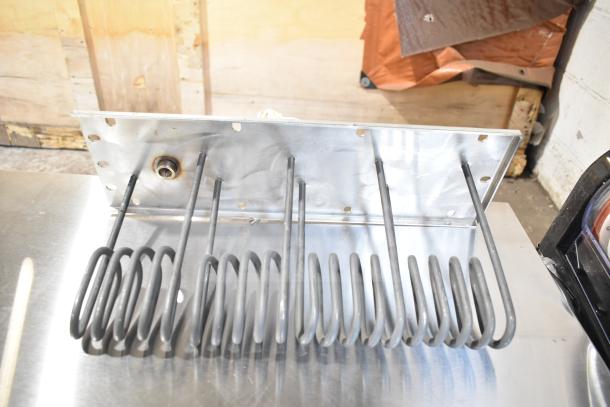 BRAND NEW SCRATCH AND DENT burner with metal coils, minor surface imperfections, ideal for replacement or repair.