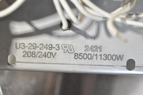 "Brand new burner with minor scratches. Markings show 208/240V, 8500/11300W. Model U3-29-249-3, code 2421."