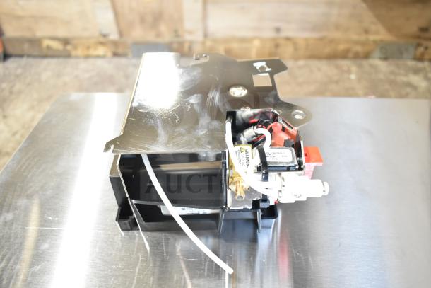 Brand new Avantco 177CHSME32IM espresso group, motor drive Crescendo, model BU50583.0501, scratches visible, tags intact.