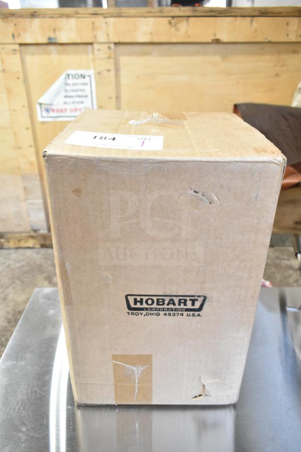 Cardboard box labeled "Hobart" with minor dents, containing a new Hobart 425WHIPSTH30 stainless steel wire whip for 30 Qt. bowls.