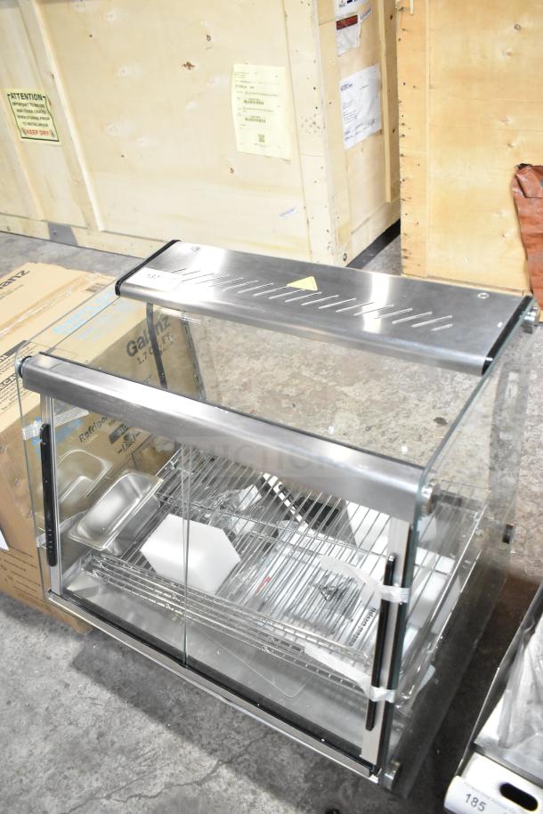 Brand new ServIt 423HDM26SA 26" heated display case, 3 shelves, sliding doors, 120 volts, scratch and dent condition.