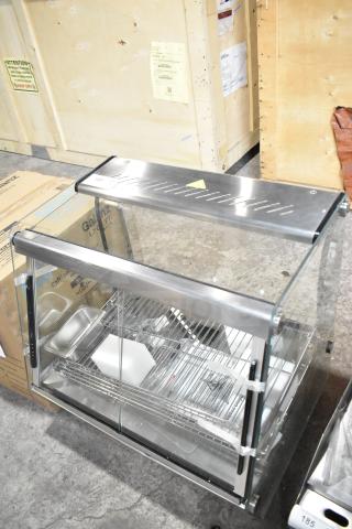 Brand new ServIt 423HDM26SA 26" heated display case, 3 shelves, sliding doors, 120 volts, scratch and dent condition.