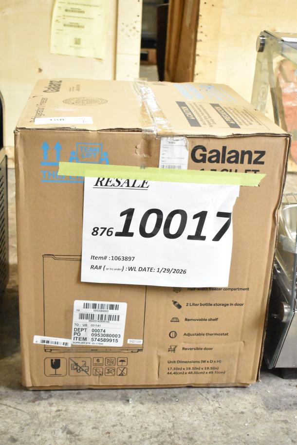 Galanz 1063897 1.7 Cu ft Mini Fridge, Black, New, in box. Features: Half-width freezer, 2L door storage, removable shelf, reversible door.