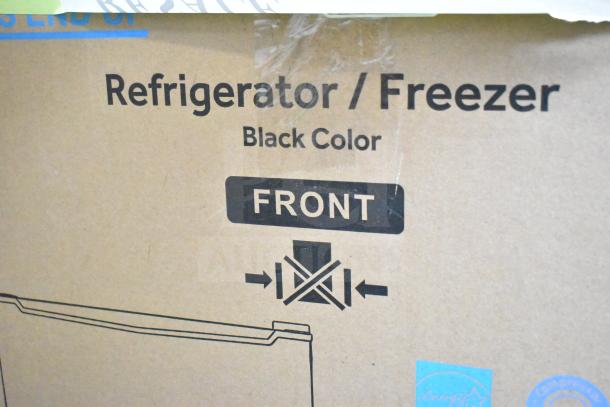 Galanz 1063897 1.7 Cu ft mini fridge in black, brand new with scratches and dents, packaging label shows front designation.