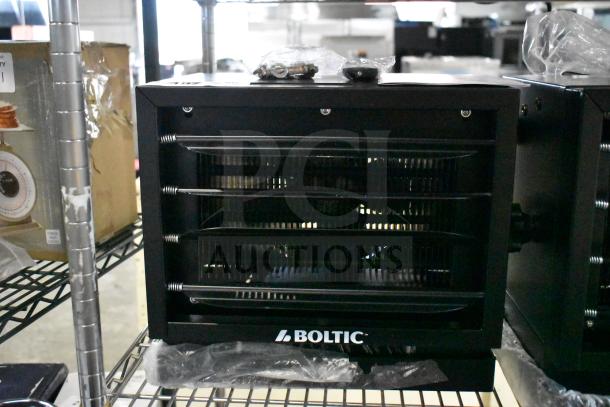 2 Brand New Boltic 73AVF7500 electric garage heaters, 240V, 7,500W, ceiling-mounted, minor scratches, visible Boltic logo.