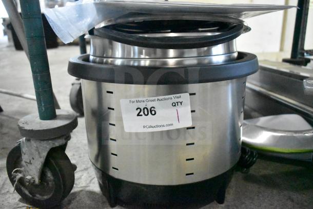 Brand new Vollrath 7411 Mirage 11 Qt. silver induction rethermalizer, 120V, 800W. Scratch and dent condition, auction label visible.