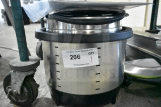 Brand new Vollrath 7411 Mirage 11 Qt. silver induction rethermalizer, 120V, 800W. Scratch and dent condition, auction label visible.