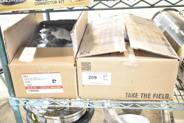 Two brand new boxes of Sioux Chief 556 Series PickUp Talon Tube Hangers for 1/2" and 3/4" CTS piping. Quantity labels visible.