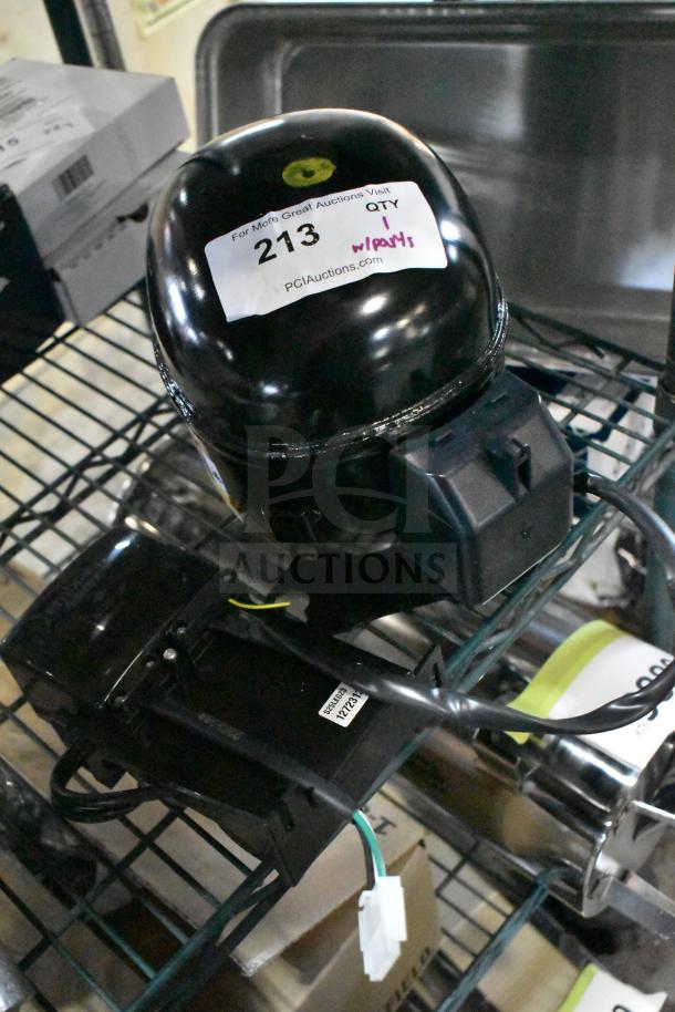 BRAND NEW SCRATCH AND DENT! Embraco NT6215Z Compressor, 115 Volts, 1 Phase, with visible labels indicating item 213.