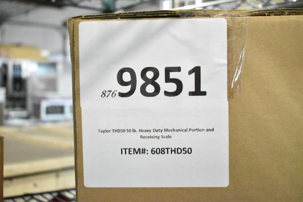 Box with Taylor THD50 50 lb. Mechanical Portion Scale, item #608THD50, scratch and dent condition, label visible.