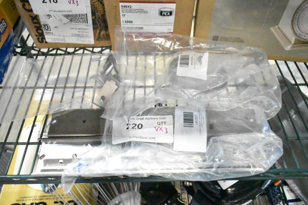 Three brand new items including Cleveland SSK00054 vent cover and Continental Refrigerator 2-517 drawer slides, marked with auction labels.