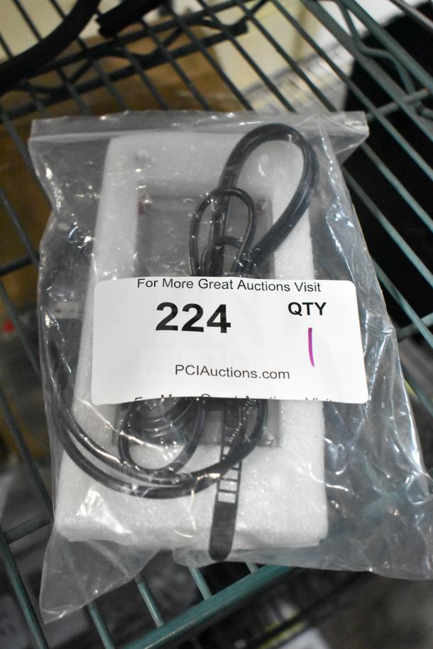 "Brand new control box, scratch and dent condition, in original packaging. Auction label reads '224, PCIAuctions.com'."