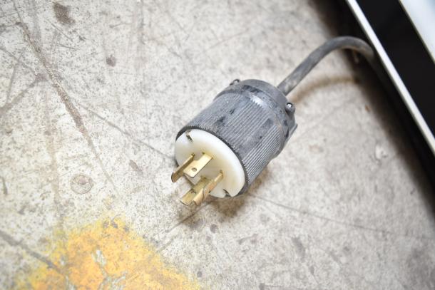 Plug of Hatco Glo Ray Commercial Heated Display Warmer, showing power connection. 120/208-230 Volts.