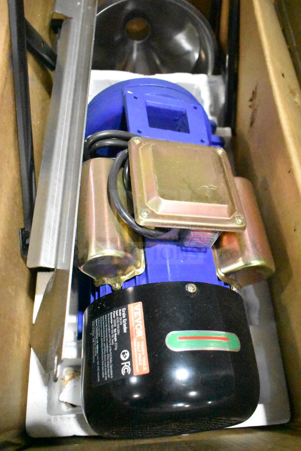 Vevor GM-001 Electric Grain Mill Grinder, 120V, 1 Phase, new in box. Visible labels indicate model and electrical specifications.