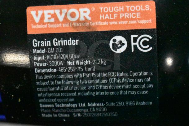 Label on Vevor GM-001 Electric Grain Mill Grinder. Details: 120V, 3000W, weight 21.2 kg, dimensions 465x255x715 mm.