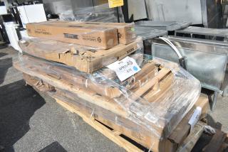 11 brand new scratch and dent items including wire shelves and bi-folding table, packaged on a pallet. Labels include "Langcaster."