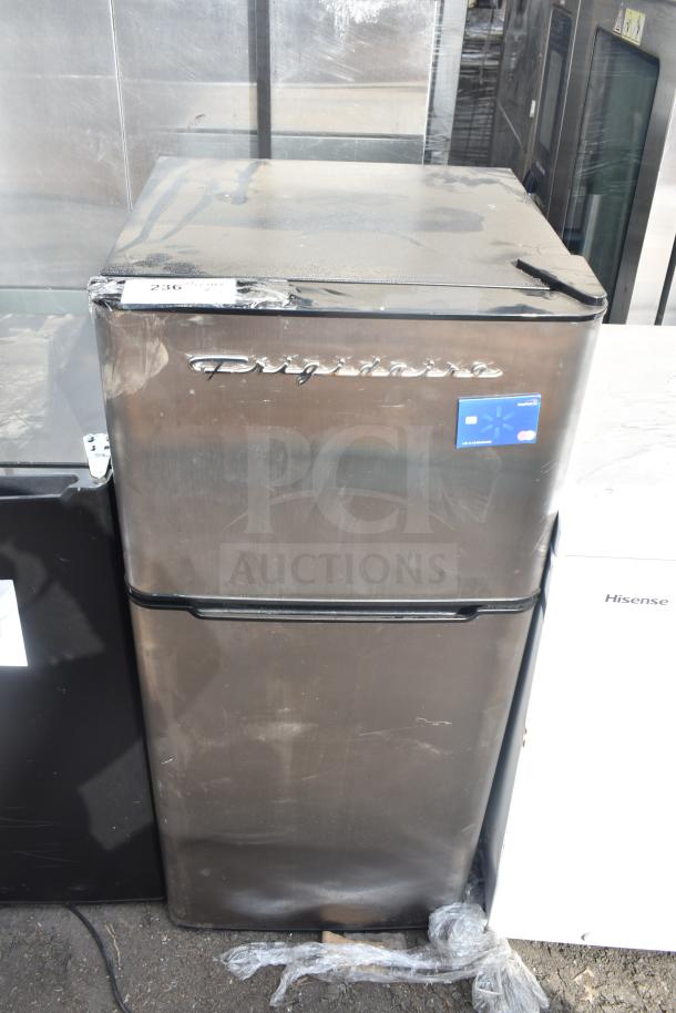 Frigidaire EFR451-B-6COM mini cooler in used condition, metallic finish, with visible dust and labeling on top front.