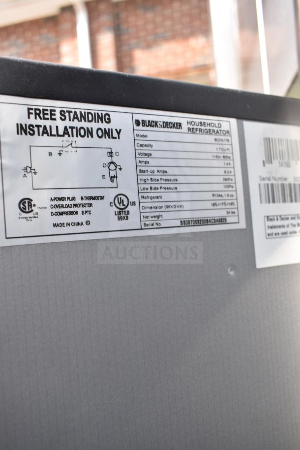 Black & Decker refrigerator label showing model BCFA17B, voltage 115V, capacity 1.7 cu. ft., freestanding installation.