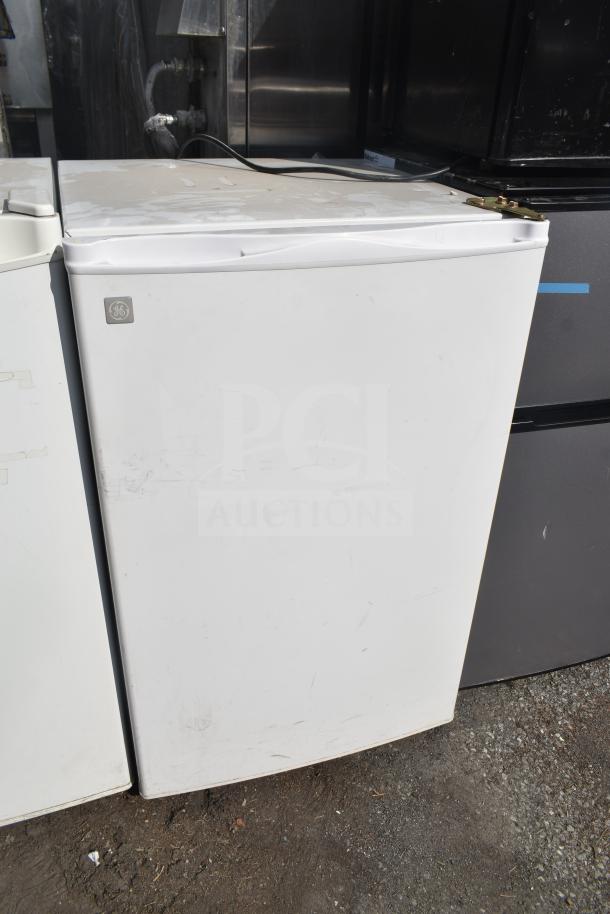 Five appliances including a Frigidaire EFR451-B-6COM mini cooler, Hisense WFC050M6XWD chest freezer, and GE GMR04AAMWW mini cooler, all in used condition.