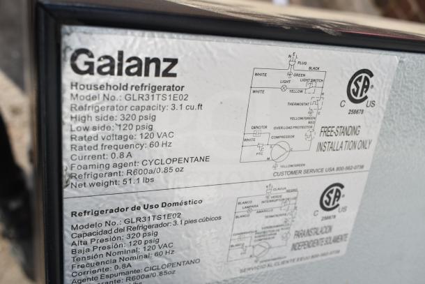 Galanz mini cooler label showing model GLR31TS1E02, 3.1 cu. ft. capacity, 120 VAC, with installation and safety details.