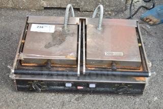 Cecilware TSG2F countertop double panini press, 230 volts, 1 phase, metal finish, used condition with visible wear and labels.