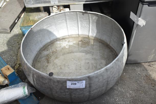 Large round metal bin, used condition, showing dirt and wear, auction tag marked "239," suitable for industrial use.