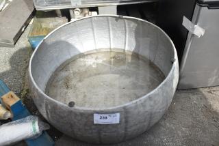 Large round metal bin, used condition, showing dirt and wear, auction tag marked "239," suitable for industrial use.