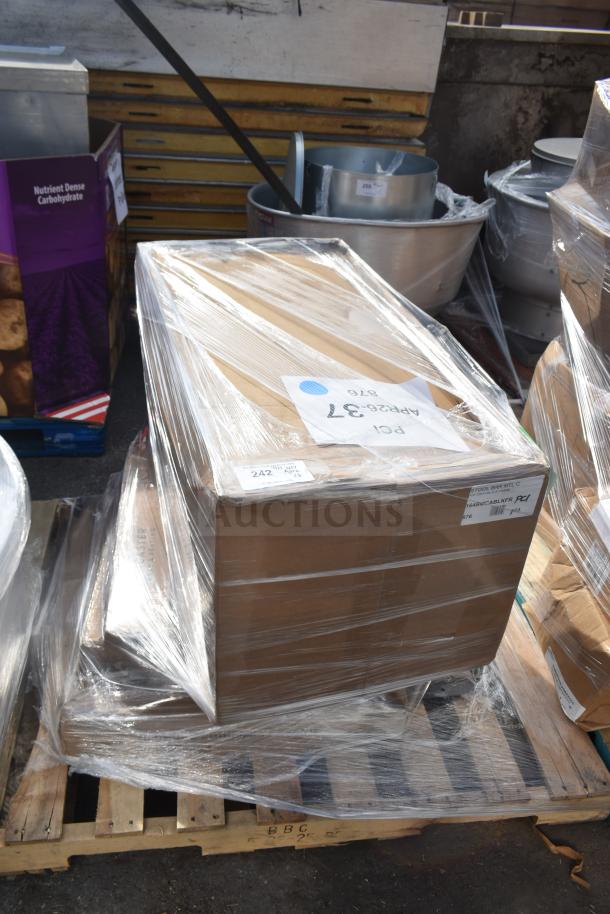 Sealed pallet with six brand new, scratch and dent items, including bar stool frame, tabletop, and equipment stand labeled "APR26-37."