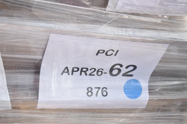 Seven new scratch and dent items including tabletop, outdoor tables, wrapped in plastic with a label: PCI APR26-62.