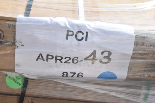 Packaged items labeled PCI APR26-43, including wire shelves, scratch and dent condition, DC approval tag visible.