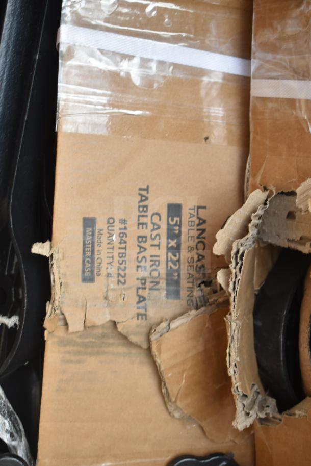 Cardboard box of Lancaster cast iron table base plate, 5"x22", marked as #164TB5222, shows minor wear.