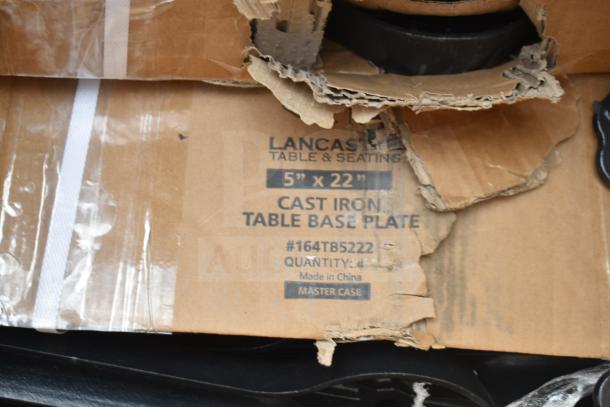 Lancaster Table & Seating cast iron table base plate in box, size 5"x22", model #164TB5222, package damaged but item new.