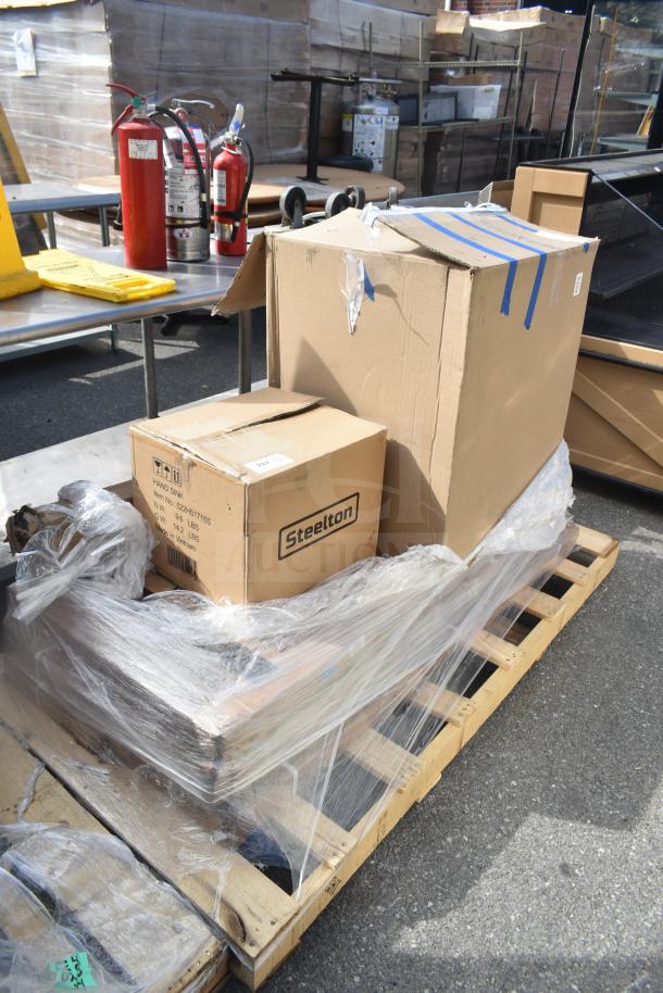 Pallet with mixed box items, including a Steelton sink. Boxes are sealed, some with minor dents. Perfect for bulk purchase.