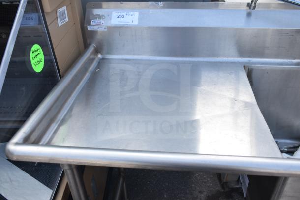 Stainless steel single bay sink with faucet and handles, Winholt label, in good condition.