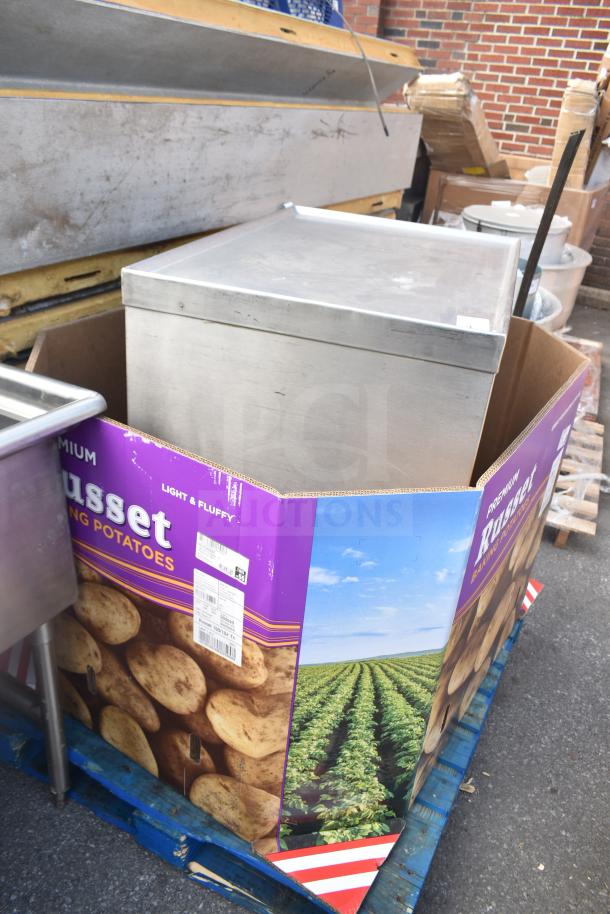 Commercial counter with drawer, under shelf, and baskets, housed in a Russet potatoes carton, stainless steel, used condition.