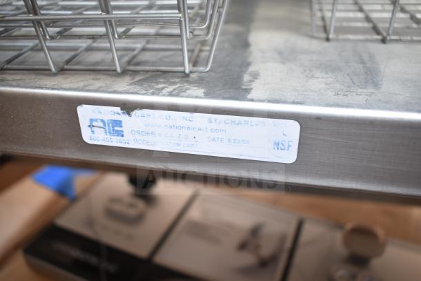 Commercial counter with drawer, under shelf, baskets. Metal build, label from National Cart Co., model "Custom Cart," order #CA-7-0.